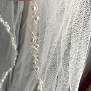 All white beaded wedding veil